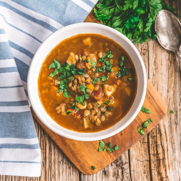 Lentil soup with carrot, tomatoes and spinach