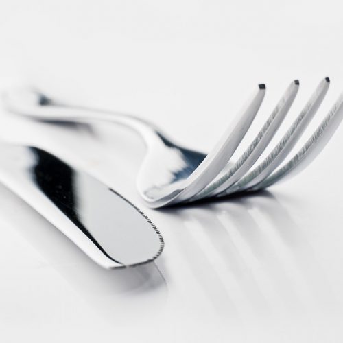 two silver bread knife and fork